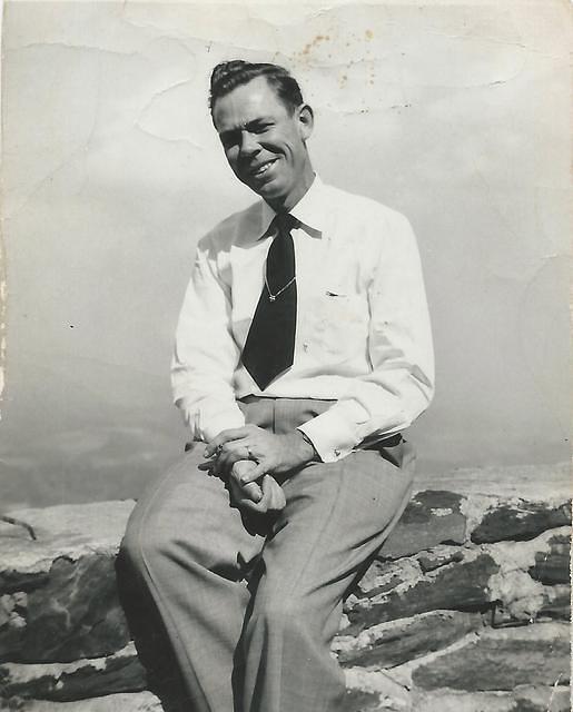 Claude Gillie Younger Sitting on Wall